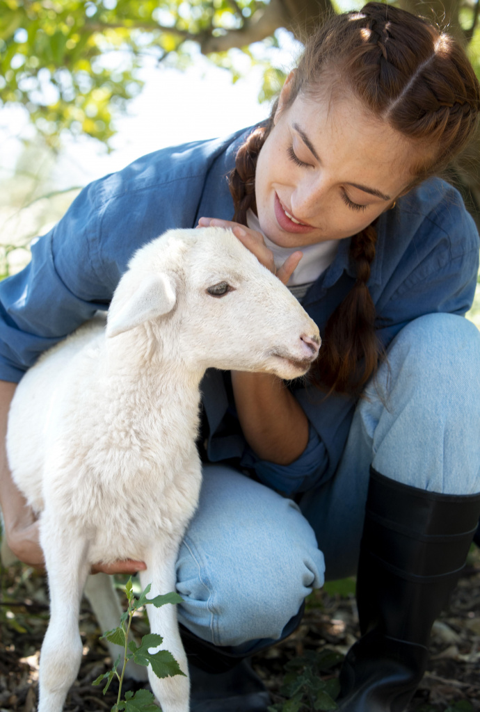 female-farmer-holding-a-baby-sheep.jpg